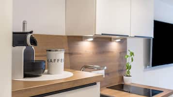 Fridge, stovetop, dishwasher, coffee/tea maker