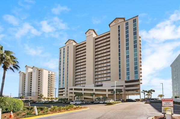 A multi-story hotel with a central atrium and parking garage. - Crystal Shores West 1207-Don't Wait any Longer! Hit that Book Now Button and Gra (Gulf Shores)