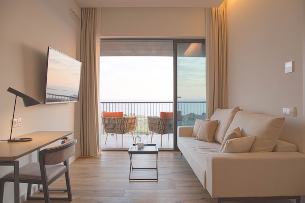 Superior Suite | Living area | 45-inch Smart TV with cable channels, TV