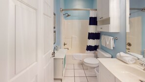 Combined shower/bathtub, hair dryer, towels - Magnolia North Unit 104 | Right in Golf Central (Myrtle Beach)