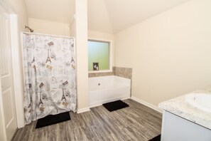 Combined shower/bathtub, hair dryer, towels, soap
