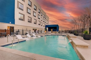 Outdoor pool, open 8:00 AM to 10:00 PM, pool umbrellas, sun loungers