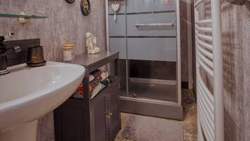 Shower, hair dryer, towels, soap