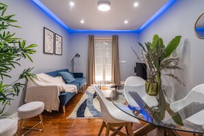 Relax in this stylish living room with a sofa, coffee table, and comfortable chairs.