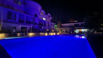 Seasonal outdoor pool, open 9:00 AM to 8:30 PM, pool loungers