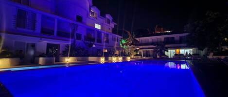 Seasonal outdoor pool, open 9:00 AM to 8:30 PM, pool loungers