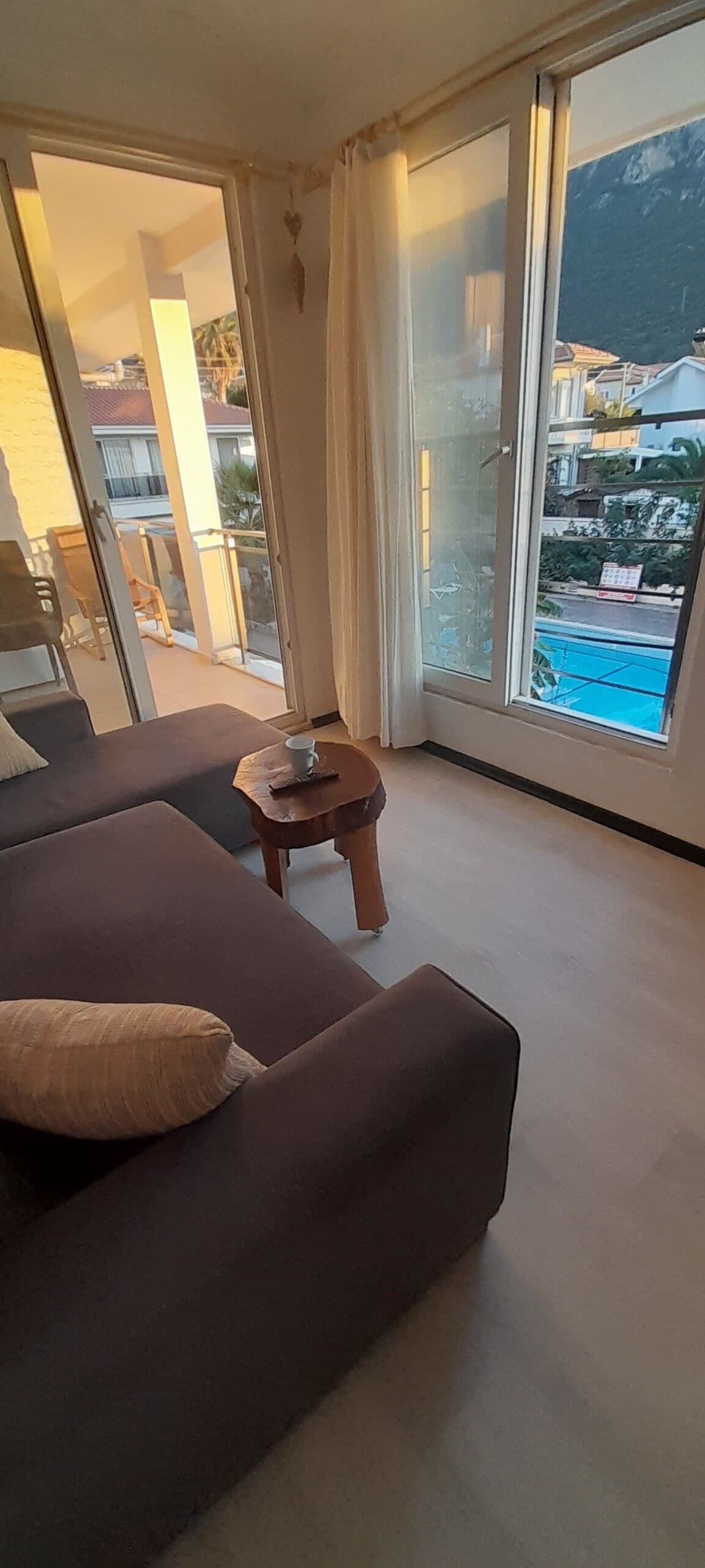 Elite Condo, Pool View | Living area | 80-cm flat-screen TV with satellite channels