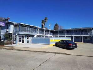 Guests can enjoy a balcony with outdoor seating on the upper floor.
