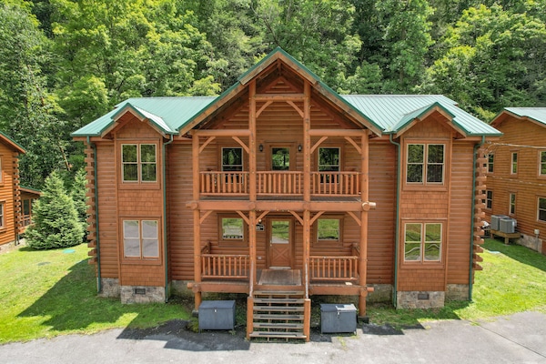 Large cabin with multiple outdoor areas.