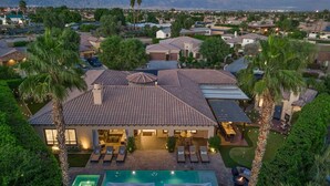 A large house with a swimming pool, multiple rooms, and a view of mountains. - The Rose at Montage - Ultimate Estate (Indio)