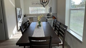 A modern kitchen with a dining area. - Country Oasis -B (Hockley)