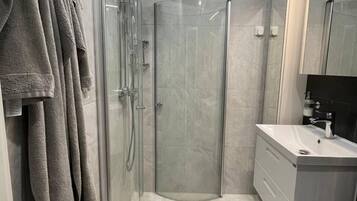 Shower, hair dryer, towels, soap