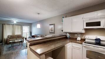 Coffee/tea maker, fridge, microwave, oven
