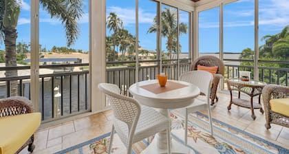 Waterfront home with private pool, dock, patio, balconies, & bikes