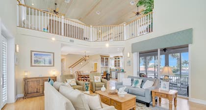 Waterfront home with private pool, dock, patio, balconies, & bikes