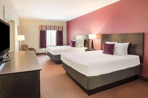 Drift off easily with two plush beds and soft lighting.