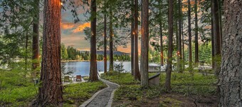 Luxe lakeside cottage with furnished porch, 2 docks, fire pit, deck, beachfront