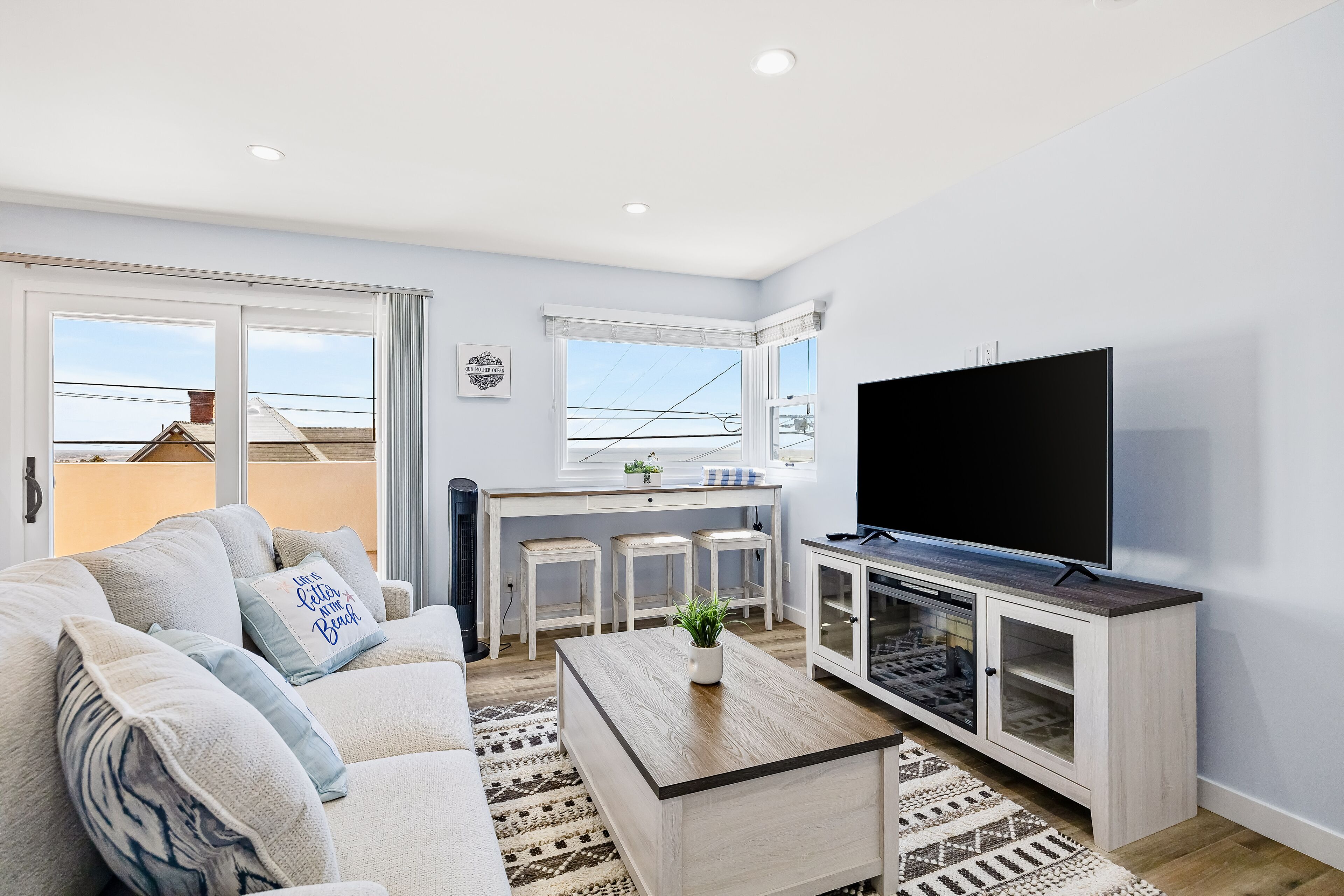 Updated cottage with ocean-view balcony, WiFi, W/D, & AC - walk to downtown