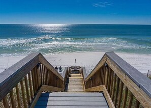 A wooden staircase leading to a beach with a clear view of the ocean. - Swim Year-Round on 30A | Heated Pool & Hot Tub (Santa Rosa Beach)