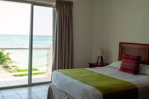 Condo, 2 Bedrooms (Beachfront, 2 Bathroom) | 2 bedrooms, in-room safe, free WiFi