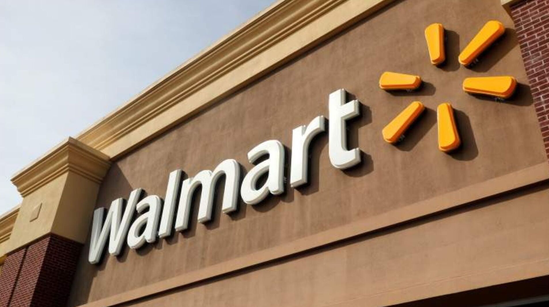 A Walmart store sign with a distinctive logo.