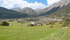 A mountainous landscape with a town nestled in the valley.