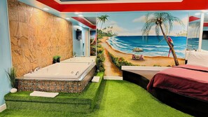 A bathroom with a large bathtub, a shower, and a mural of a beach scene. - Inn of The Dove Harrisburg-Hershey Romantic Suites (Harrisburg)