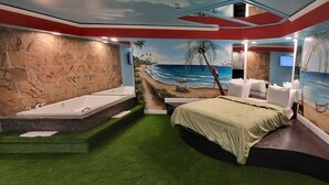 A room with a beach mural, a bathtub, and a bed. - Inn of The Dove Harrisburg-Hershey Romantic Suites (Harrisburg)