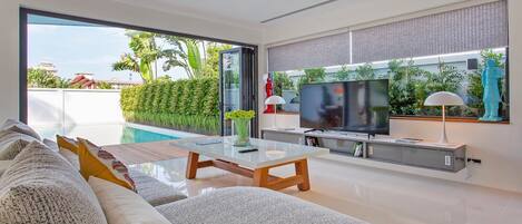 Luxury Villa | Living area | 46-inch flat-screen TV with cable channels