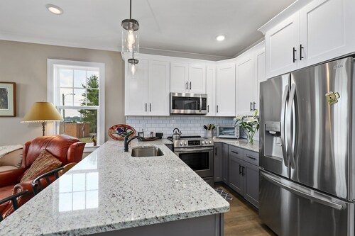 Lovely townhome with water-view, balcony, central AC & washer/dryer