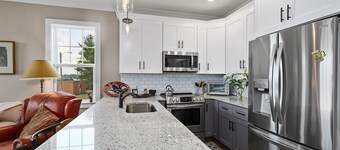 Lovely townhome with water-view, balcony, central AC & washer/dryer