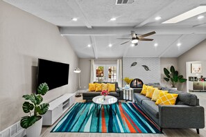 Smart TV, fireplace, table football, books