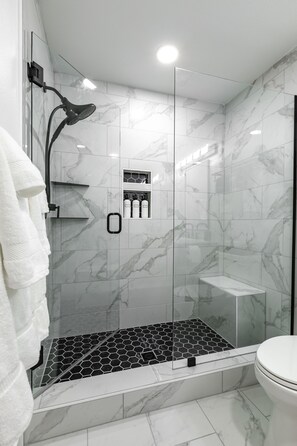 Bathtub, hair dryer, towels, soap