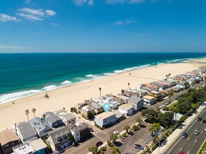 A coastal town with a beach, residential buildings, and a road. - 2 bedroom close to the beach on 65th St (Newport Beach)