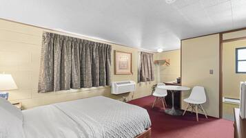 Economy Room, 1 Queen Bed | Individually decorated, individually furnished, blackout drapes