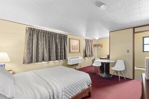 Economy Room, 1 Queen Bed | Individually decorated, individually furnished, blackout drapes