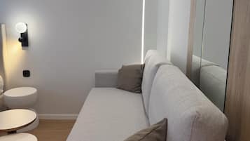 Superior Studio Suite | Minibar, in-room safe, laptop workspace, blackout drapes
