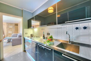 Family Villa, Multiple Bedrooms, 2 Bathrooms, Mountainside (Casa Francesca Garden And View) | Private kitchen | Fridge, microwave, oven, stovetop - Casa Francesca Garden And View (Castelveccana)