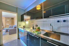 Family Villa, Multiple Bedrooms, 2 Bathrooms, Mountainside (Casa Francesca Garden And View) | Private kitchen | Fridge, microwave, oven, stovetop - Casa Francesca Garden And View (Castelveccana)