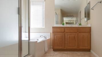 Combined shower/bathtub, towels, soap, shampoo