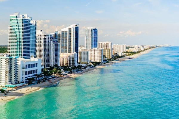 On the beach, sun-loungers, beach towels