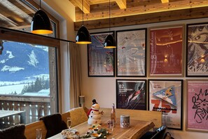 Enjoy meals in a warm and inviting dining area with a view of the surrounding mountains.