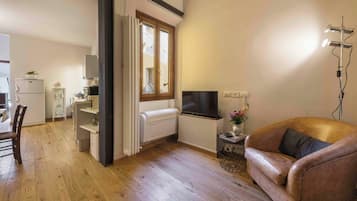 Comfort Apartment | Living area | 40-inch flat-screen TV with digital channels, TV