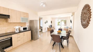 Comfort Apartment | Living area | TV