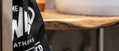 A black bag with white text hanging on a hook.