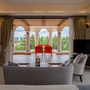 Balcony Suites | Living area | 42-inch Smart TV with cable channels, TV, Netflix