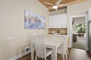 Enjoy cooking in this well-equipped kitchen with a large island and window offering a view of the outdoors.