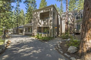Stunning homes with balconies and porches, set amidst a serene natural landscape and beautifully maintained gardens.