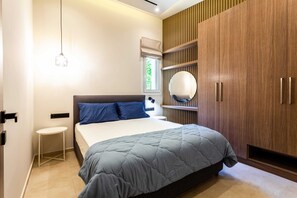 1 bedroom, desk, iron/ironing board, travel crib