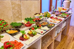 A buffet with various food items and garnishes. - Ardey Hotel (Istanbul)